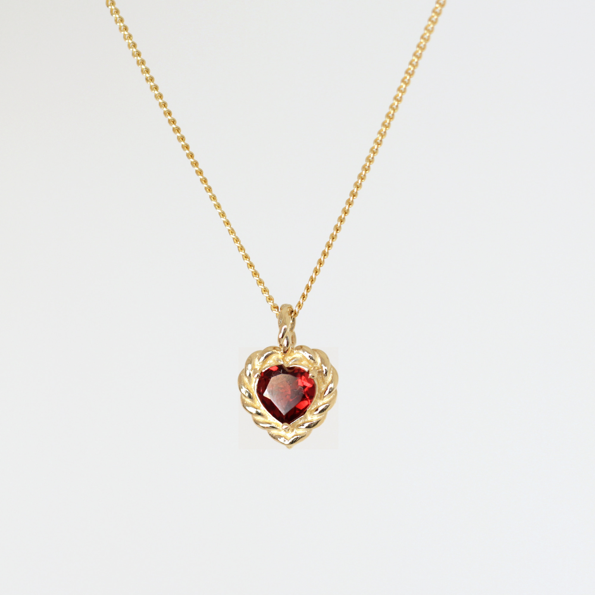 Classic twisted garnet heart necklace